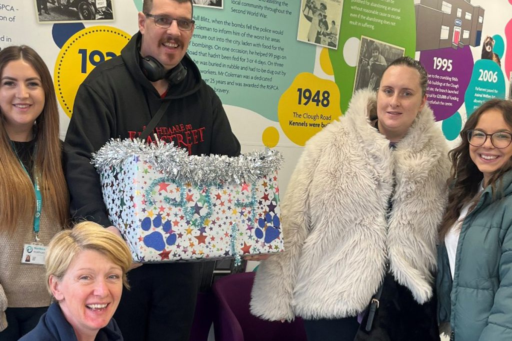 Group of people with Christmas Hamper to Donate