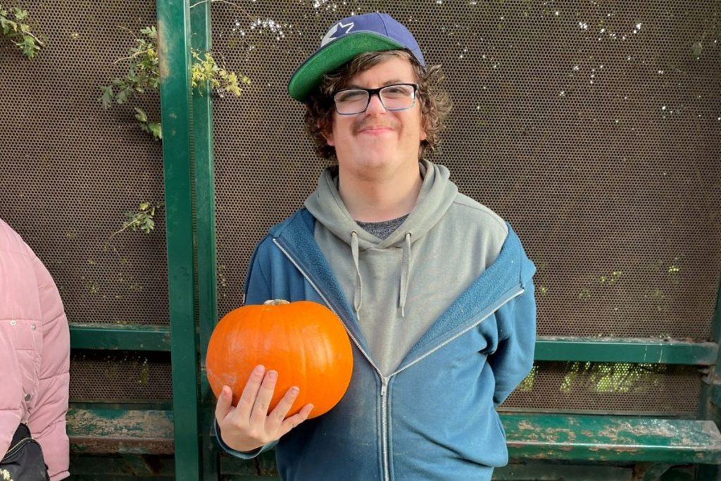 Gentleman holding a pumpkin