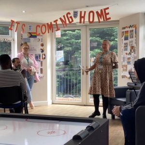 Lady speaking to group about inclusion