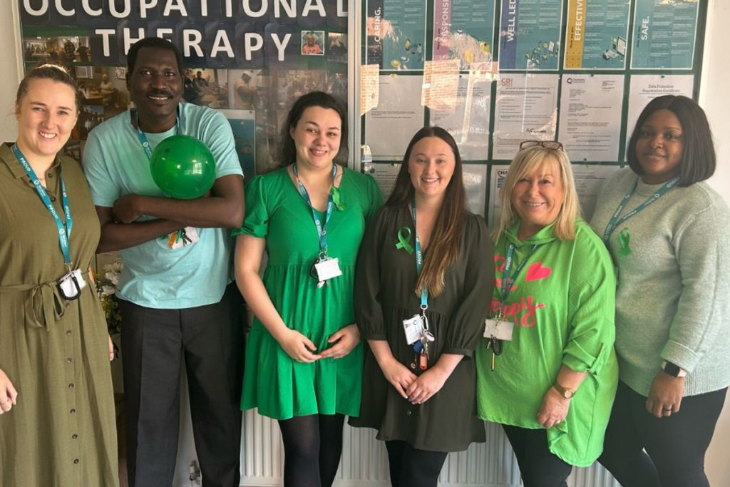Group dressed in green for Mental Health Awareness Week