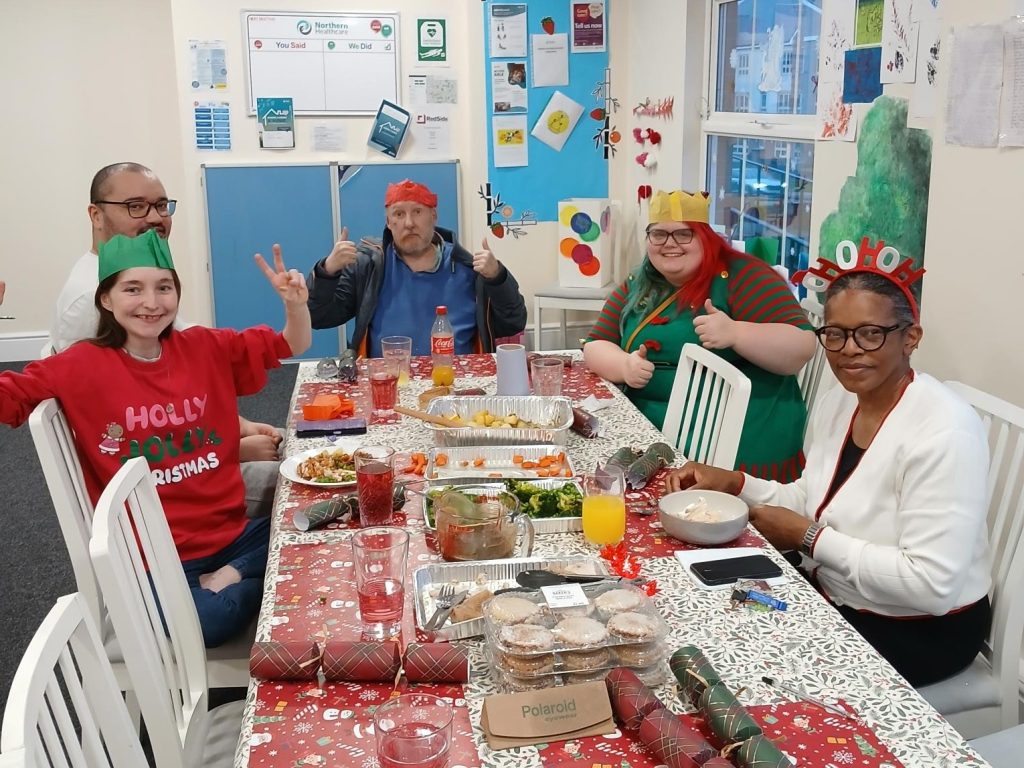 Group of people enjoying christmas dinner