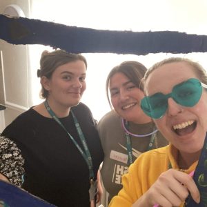 Three ladies posing in a handmade frame